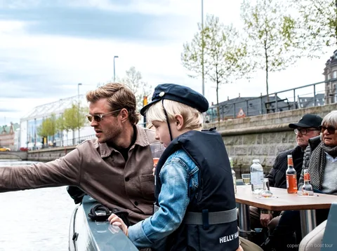 Small group of passengers on the Copenhagen electric canal tour boat near Nyhavn