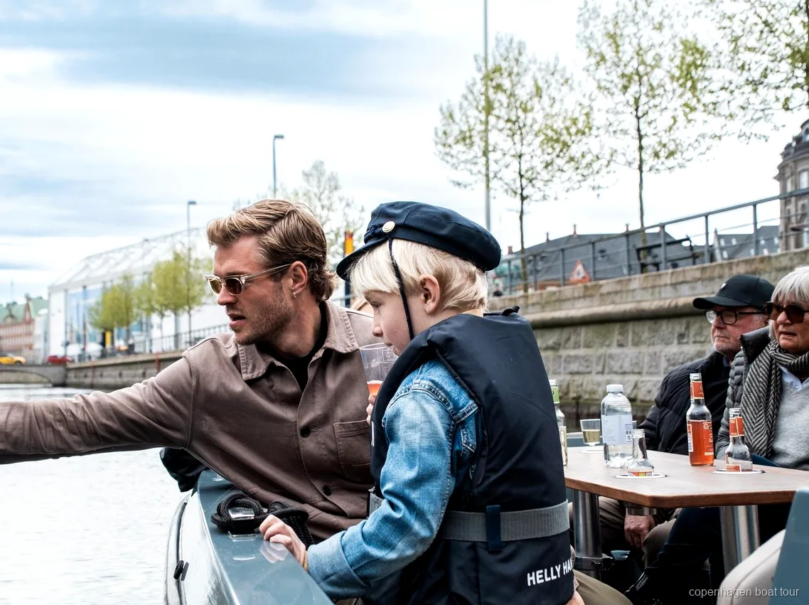 Small group of passengers on the Copenhagen electric canal tour boat near Nyhavn