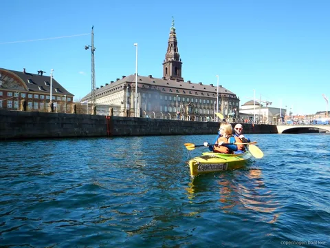 Paddlers on the Copenhagen harbor kayak tour entering Christianshavn's canals