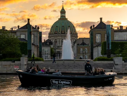 Travelers on the Copenhagen hidden gems 2 hour social boat tour near Trekroner Fort